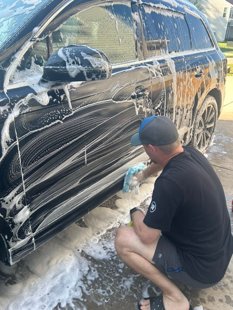 Gentle hand wash on a black car